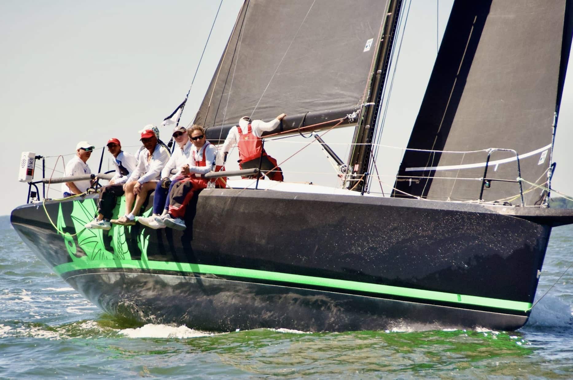 Christopher Dragon sailing upwind with a suit of black UK Sailmakers Titanium sails.