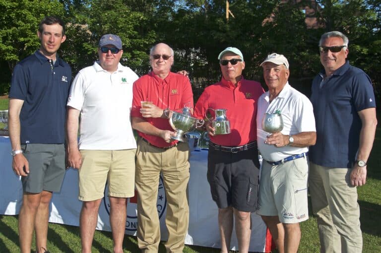 The Christopher Dragon crew holds their trophies from their overall win at the 2023 Block Island Race.
