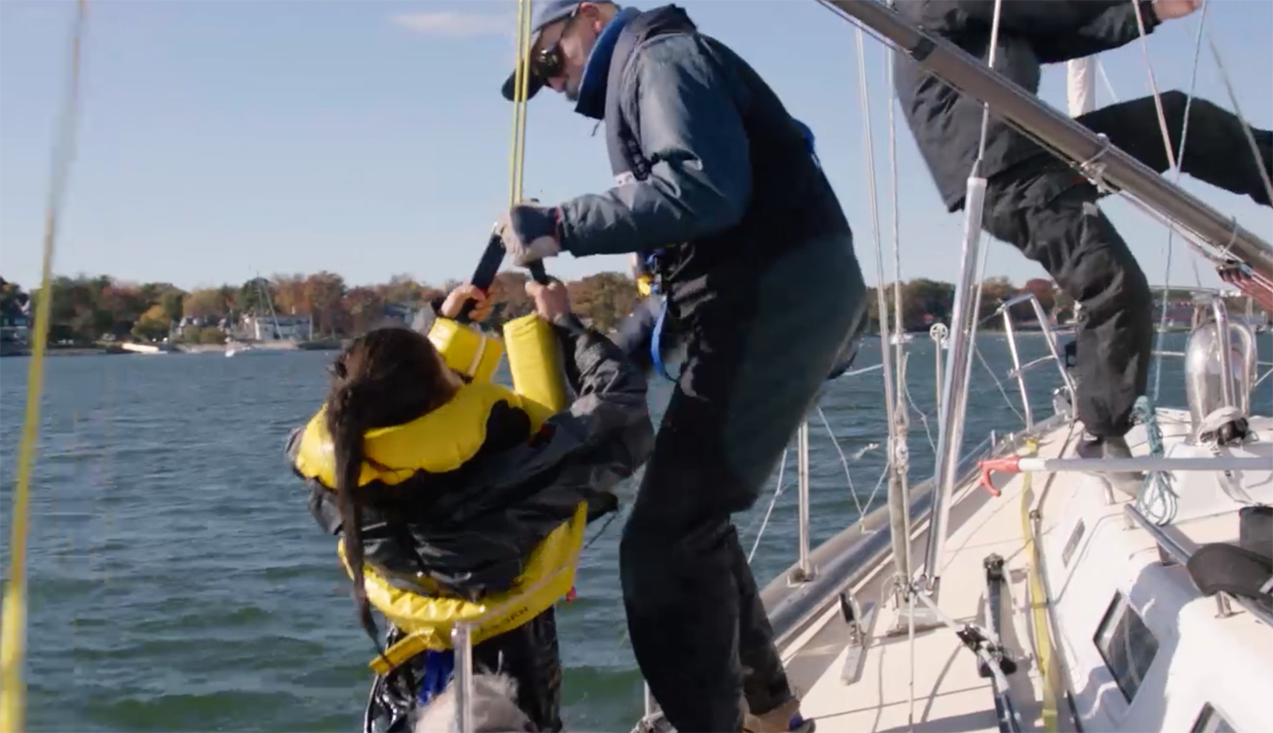 Crewmembers on deck should be tethered to the boat when recovering a MOB.