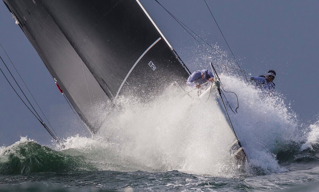 The bowman at work on the bow of the Reichel/Pugh 76 JELIK.