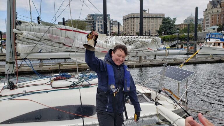 Eric Pesty rings the bell in Victoria in the 2022 R2AK. Image credit - R2AK Facebook Page.